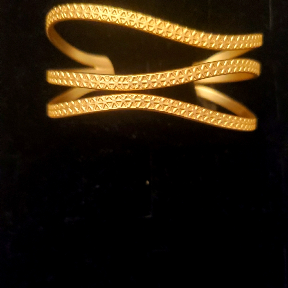 20% off w/purchase 3 items.  Goldtone cuff